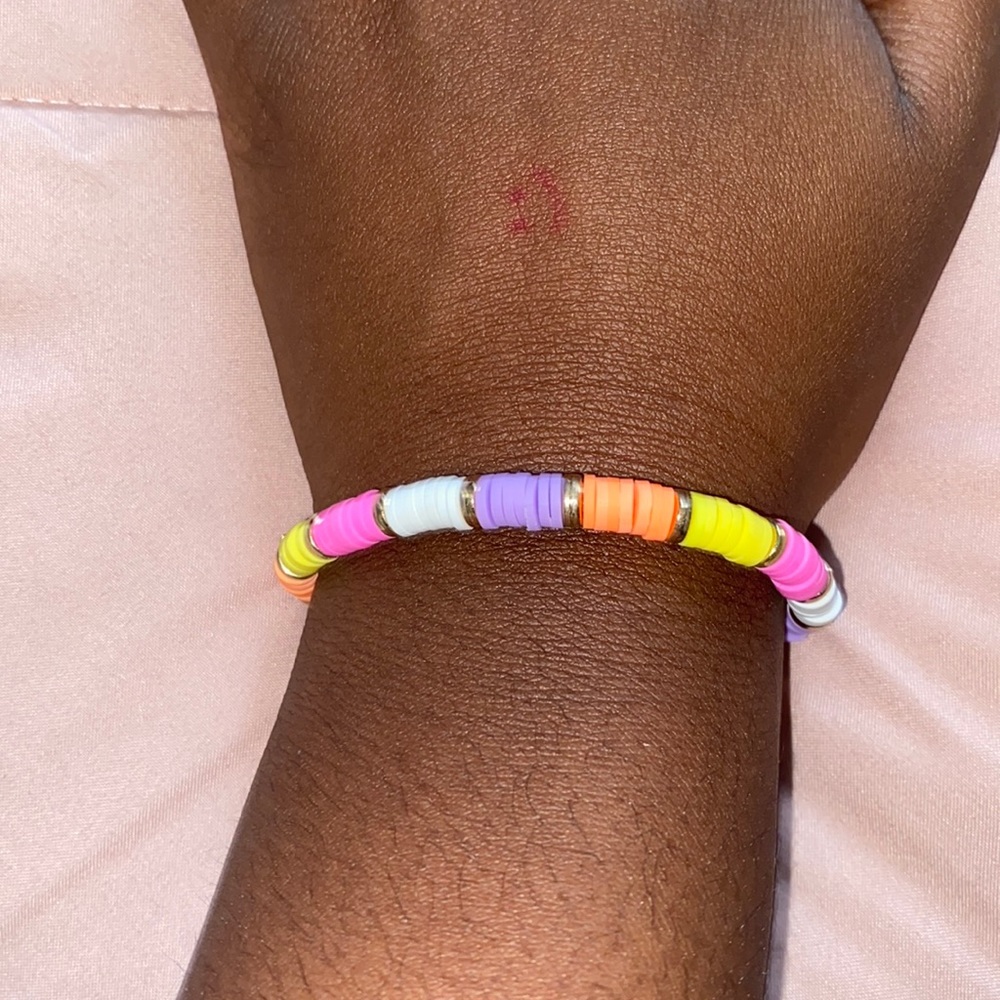 pink white purple coral and yellow bracelet